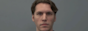 ominous picture of jerma with a gray background